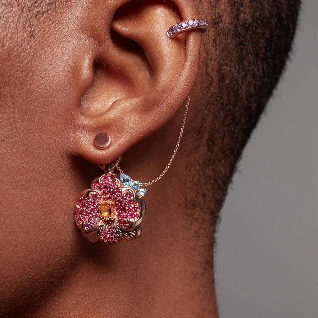 Rose gold orchid drop earring with multicolored stones and pink ear cuff.