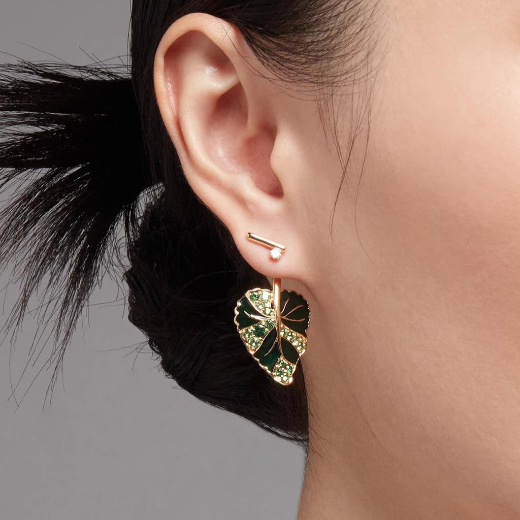 Rose gold bar stud earring with small diamond paired with green leaf charm