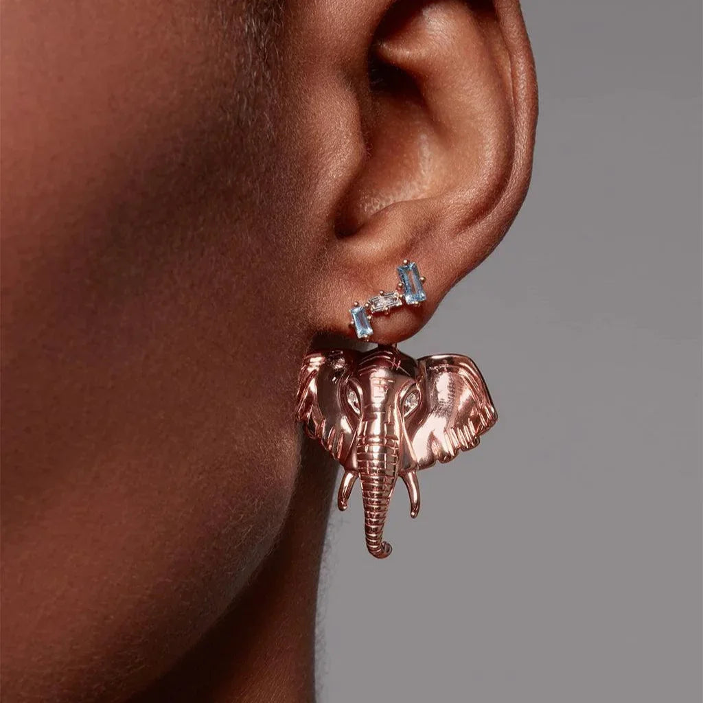 Blue topaz baguette ear crawler paired with rose gold elephant statement charm