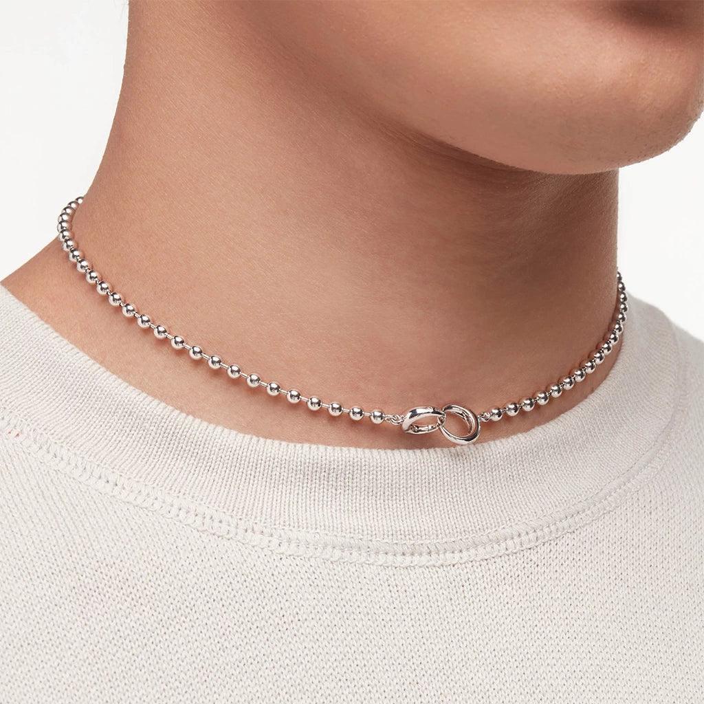 Silver ball chain choker necklace with signature interlocking clasp on male model