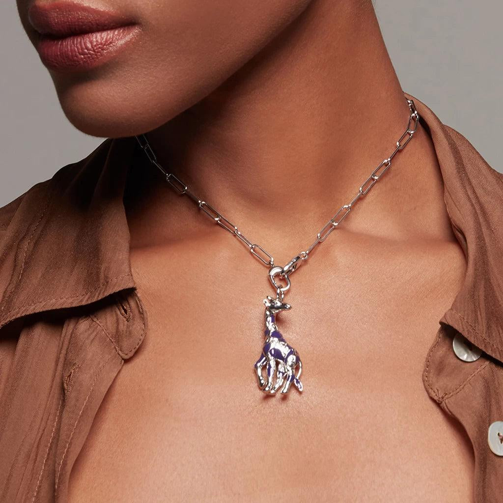 Bold silver paperclip chain necklace with sculpted giraffe charm on model