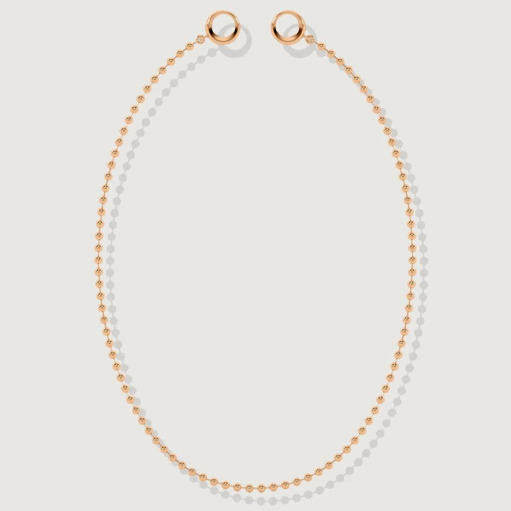 Rose gold baby ball chain necklace laid flat with round clasp ends