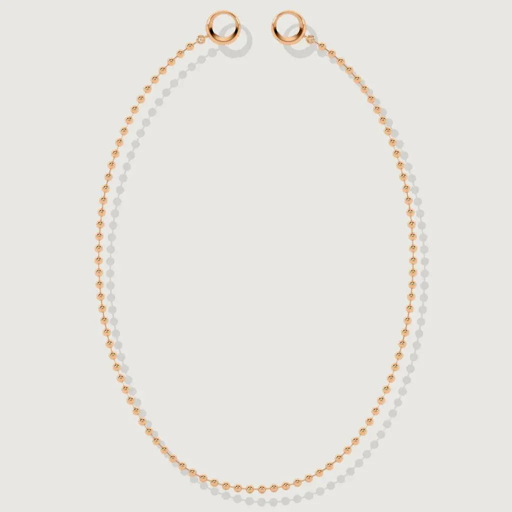 Rose gold baby ball chain necklace laid flat with round clasp ends