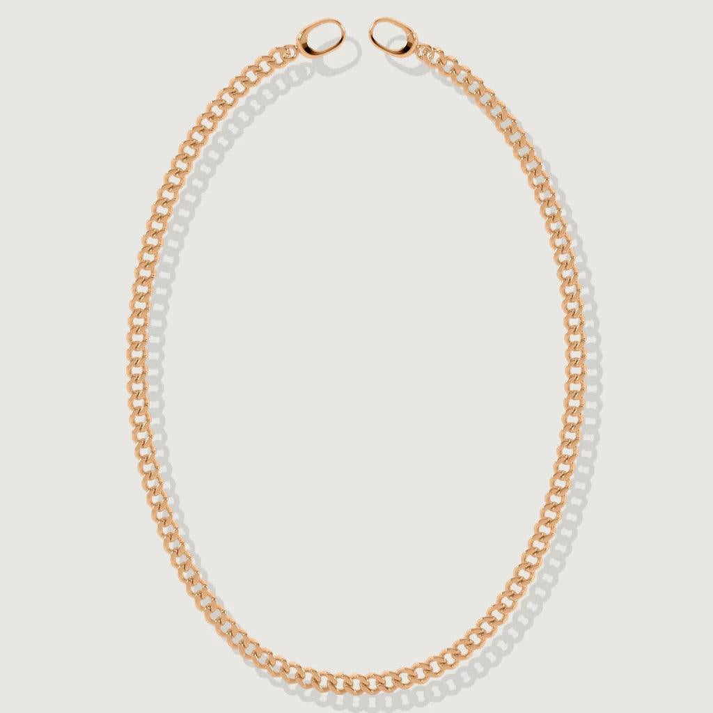Minimalist rose gold Cuban chain necklace laid flat on a white background.