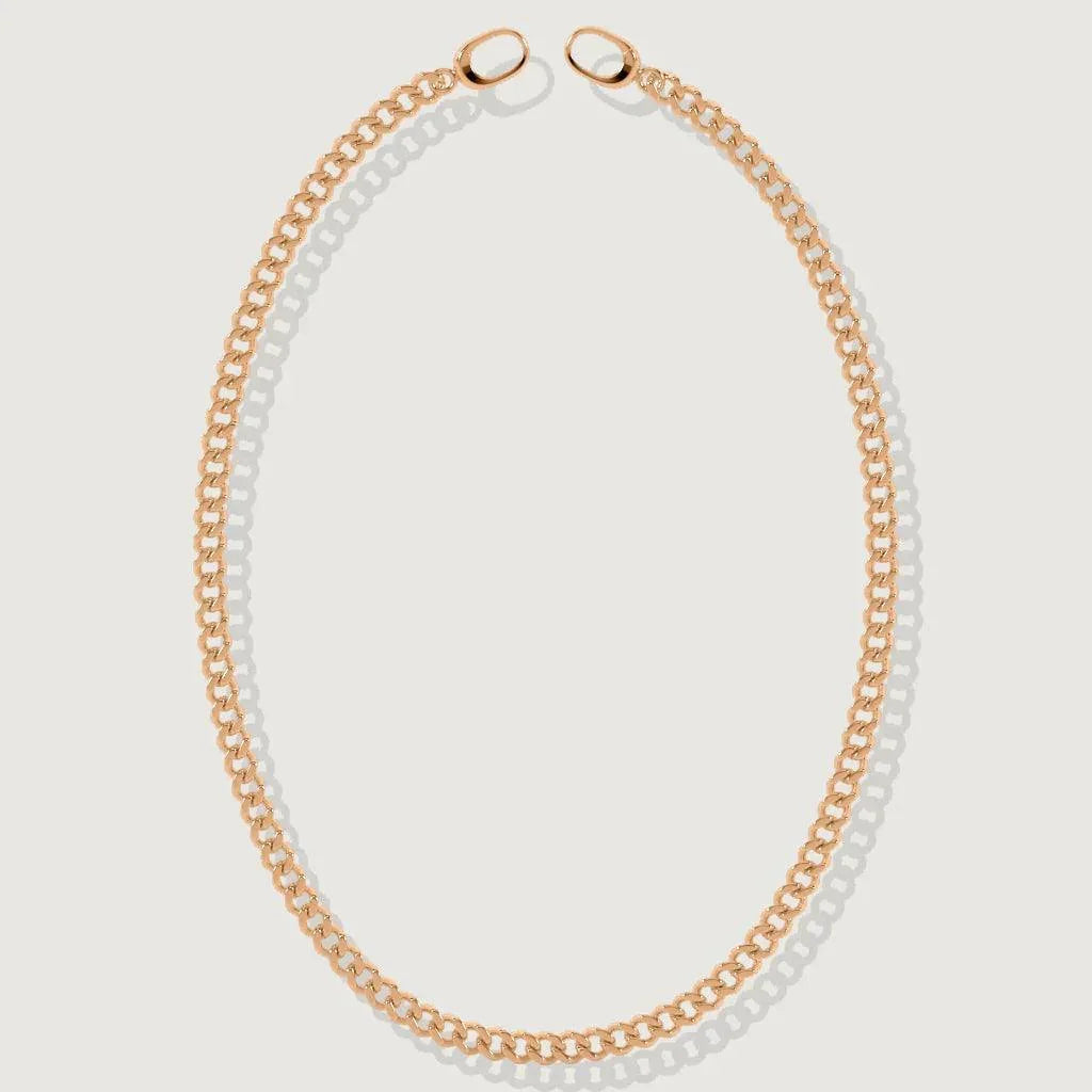 Minimalist rose gold Cuban chain necklace laid flat on a white background.