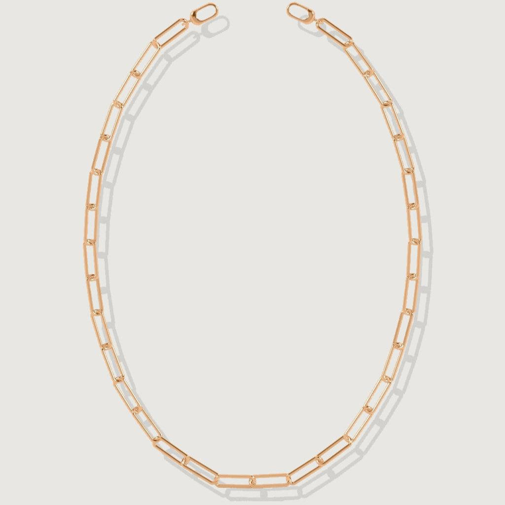 Rose gold paperclip chain necklace laid flat on white background.