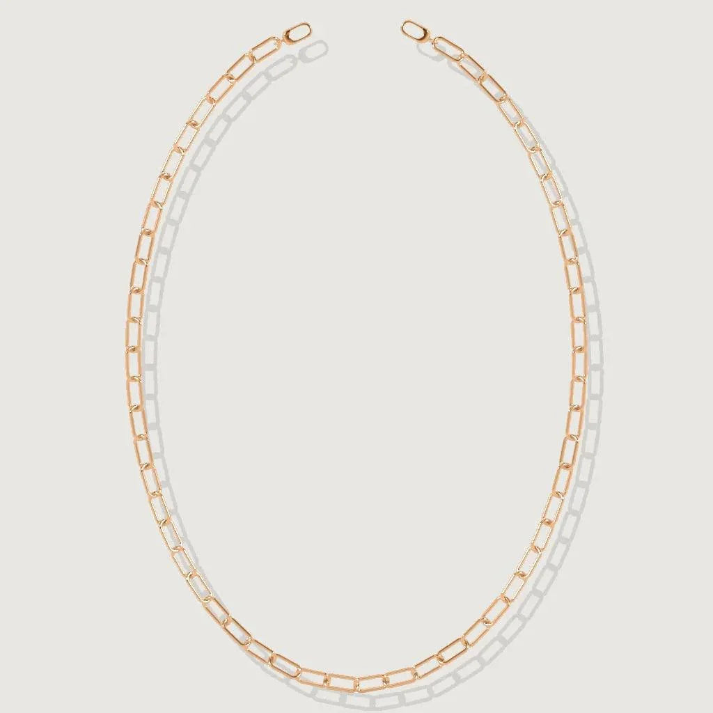 Minimalist rose gold paperclip chain necklace on white background