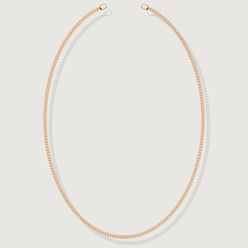 Sleek rose gold-tone long Cuban chain necklace laid flat on a white background.
