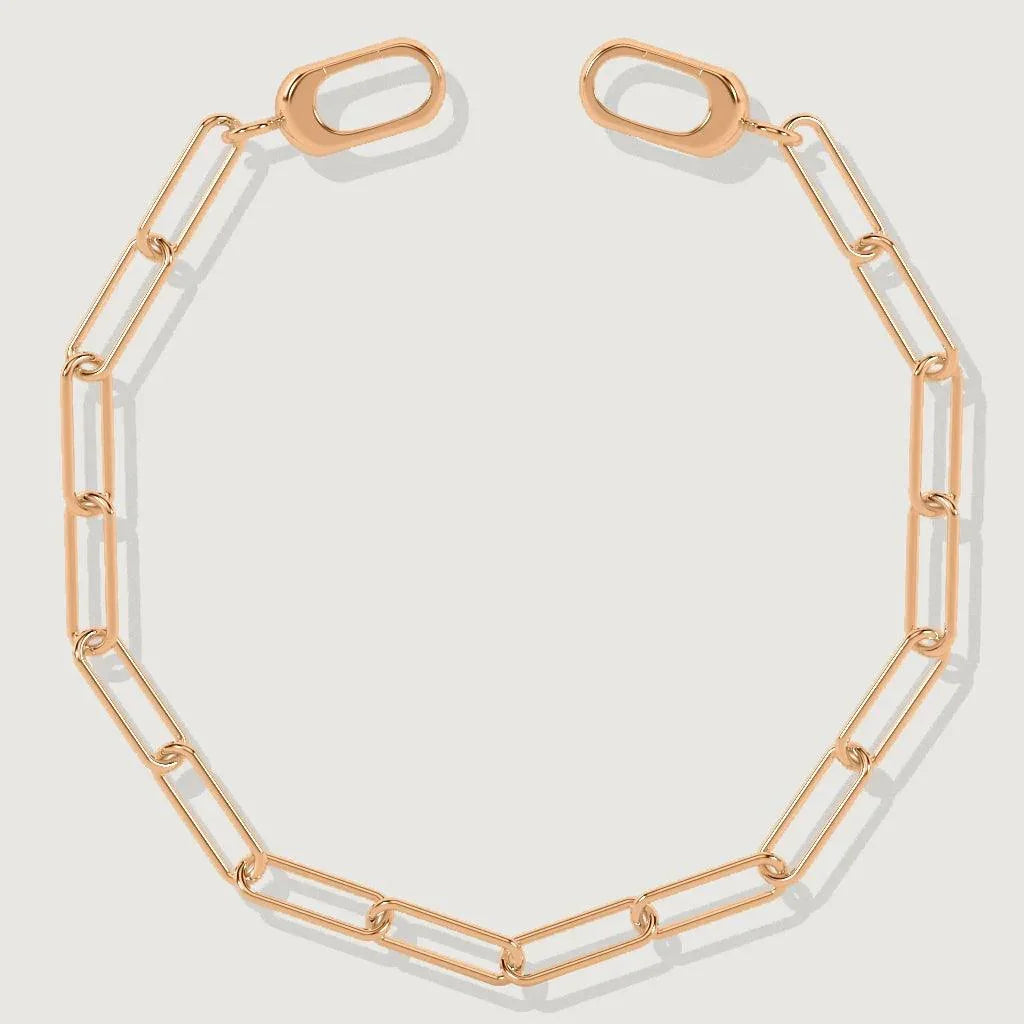 Rose gold paperclip chain bracelet laid flat – versatile charm-ready jewelry piece.