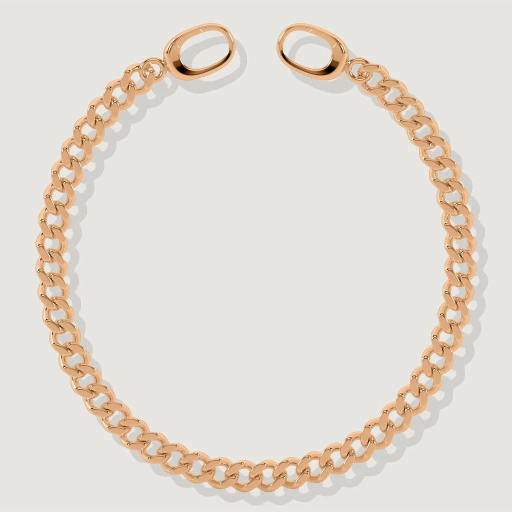 Close-up of rose gold Cuban chain bracelet with oval clasps laid flat