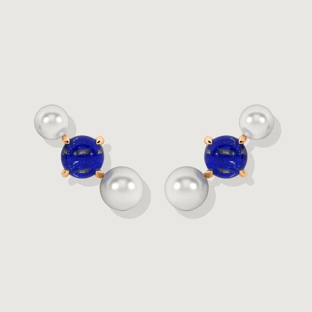 Product photo of pearl and lapis lazuli cluster stud earrings on white background.