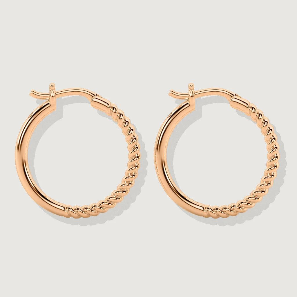 Pair of rose gold-tone hoop earrings featuring half smooth and half twisted rope detailing.