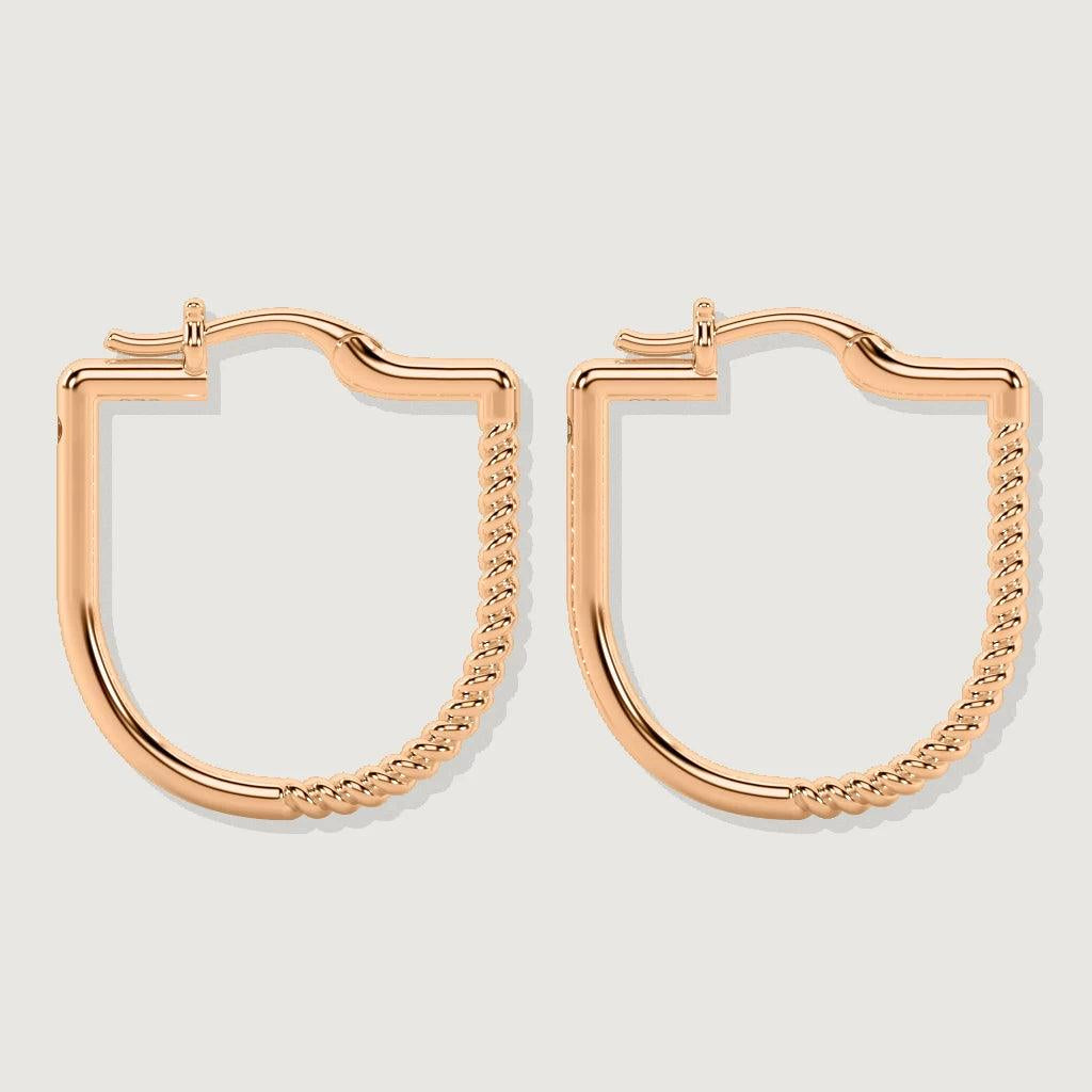 Pair of rose gold square hoop earrings with one half of each hoop featuring a twisted rope design, displayed on a light grey background.