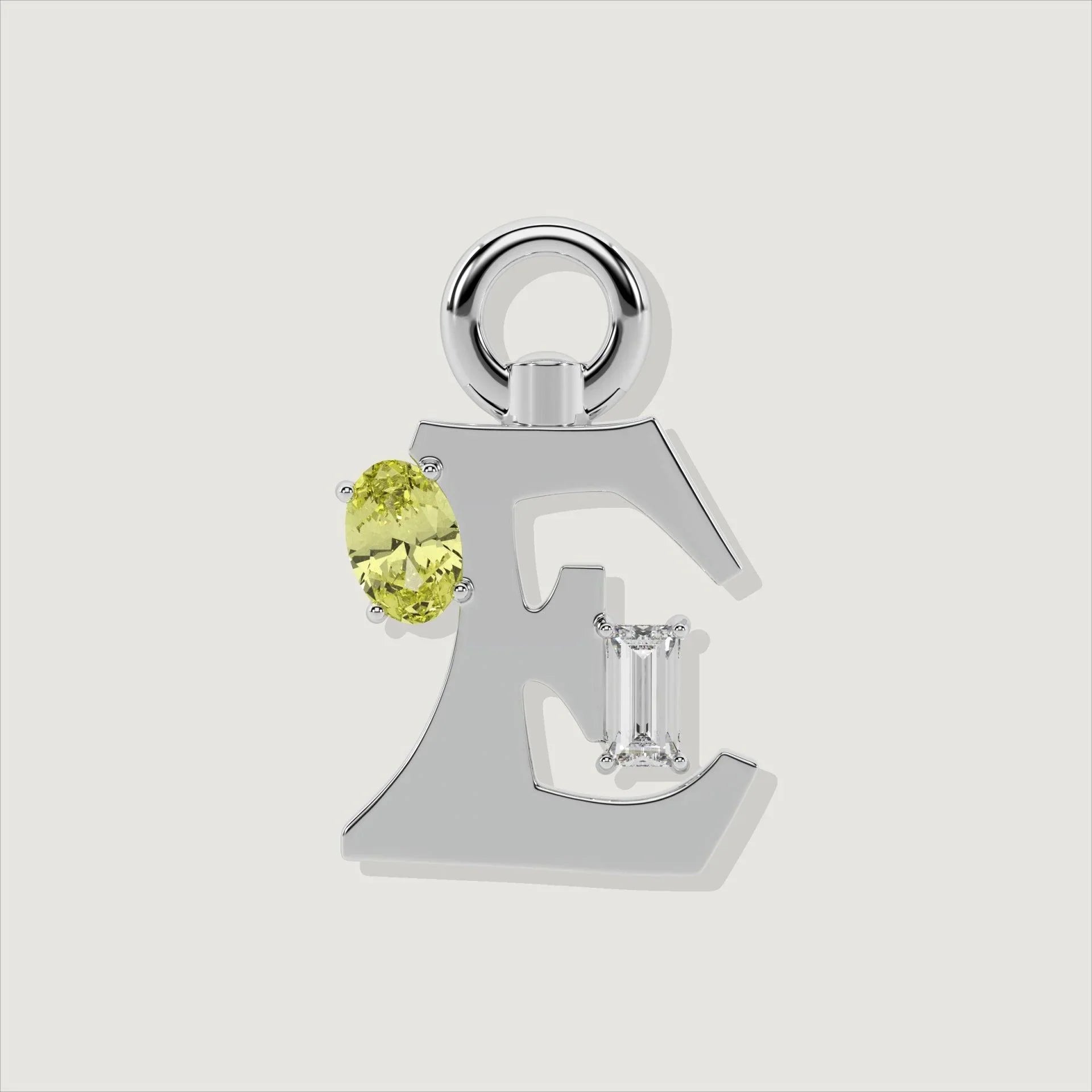 Silver letter E charm featuring oval yellow gemstone and baguette-cut clear stone.