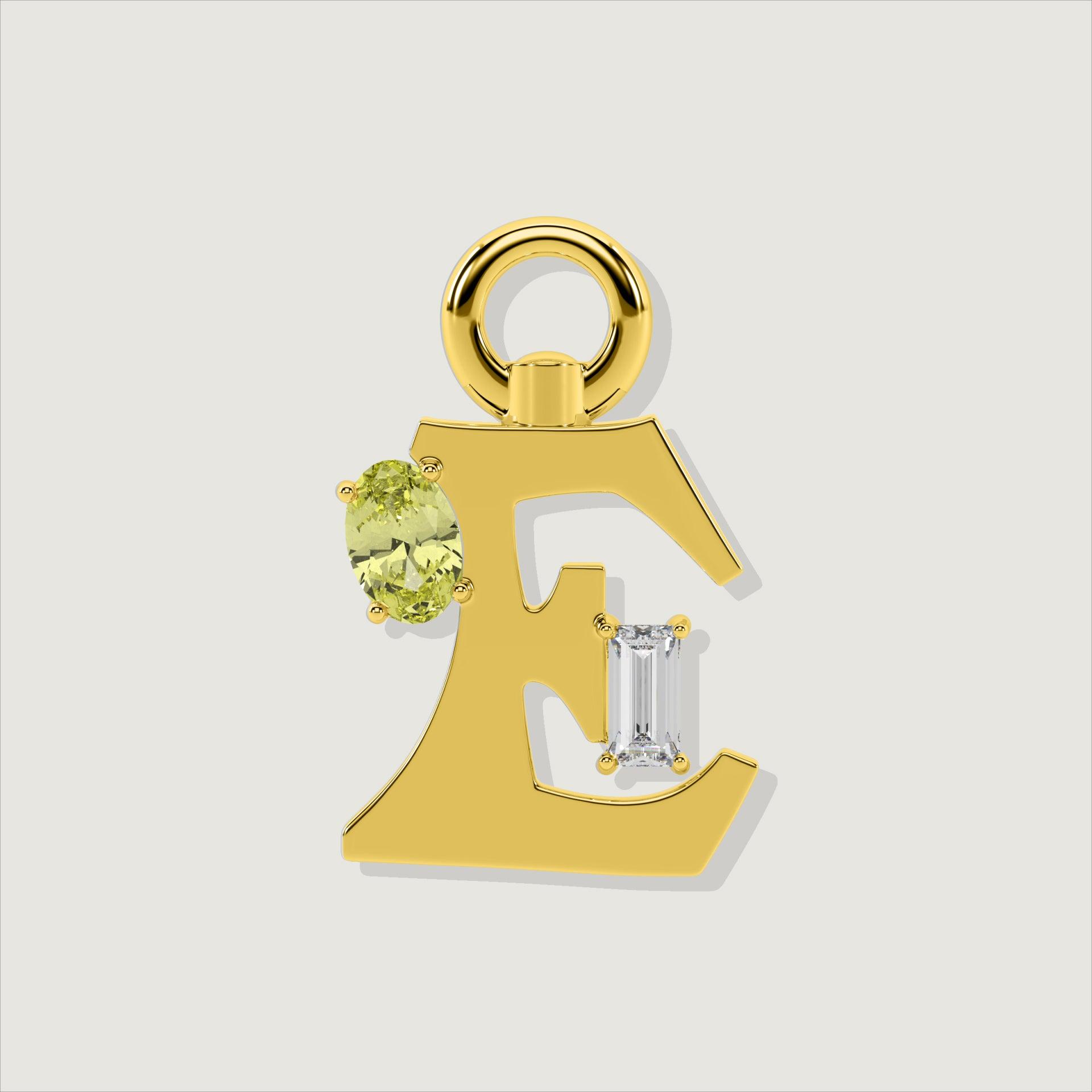 Gold letter E charm featuring oval yellow gemstone and baguette-cut clear stone.