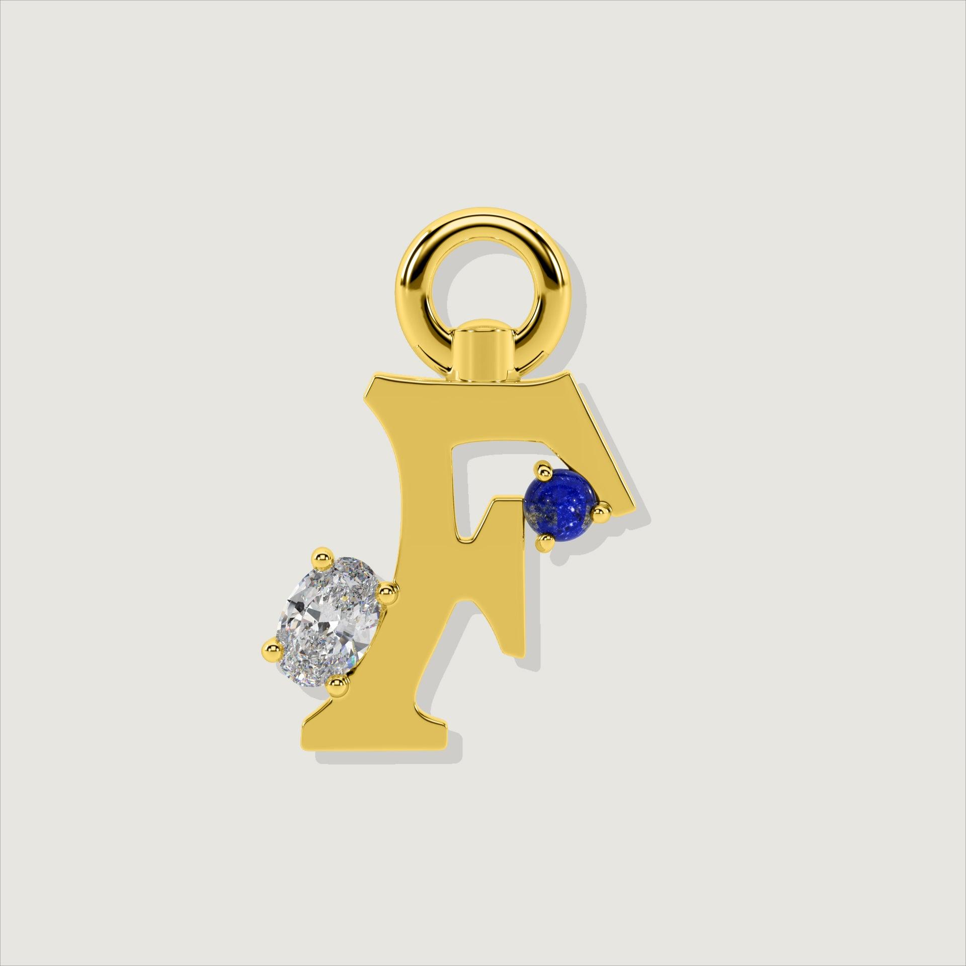 Gold letter F charm adorned with a round blue lapis and oval clear stone.