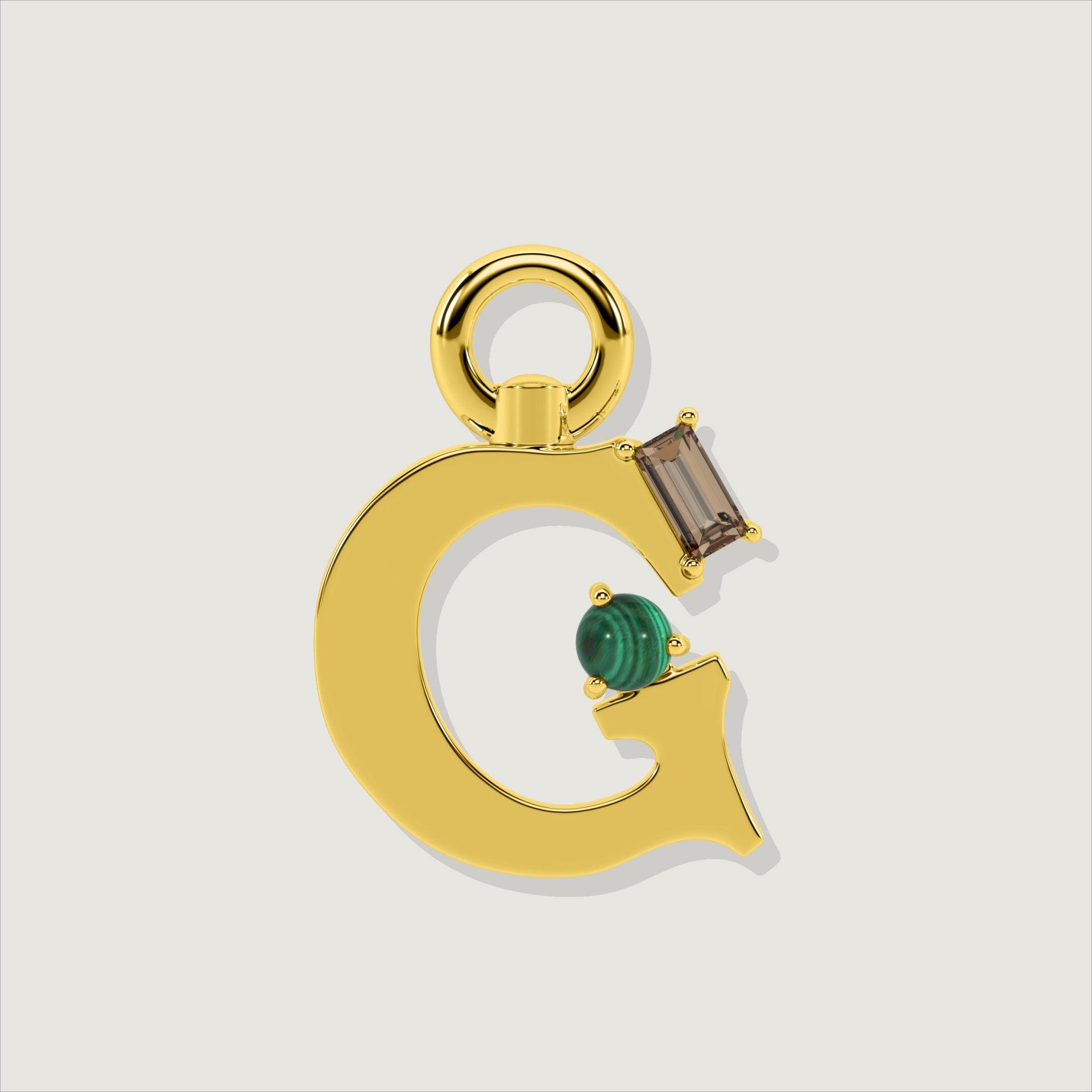 Gold letter G charm with rectangular smoky quartz and round green malachite stones.