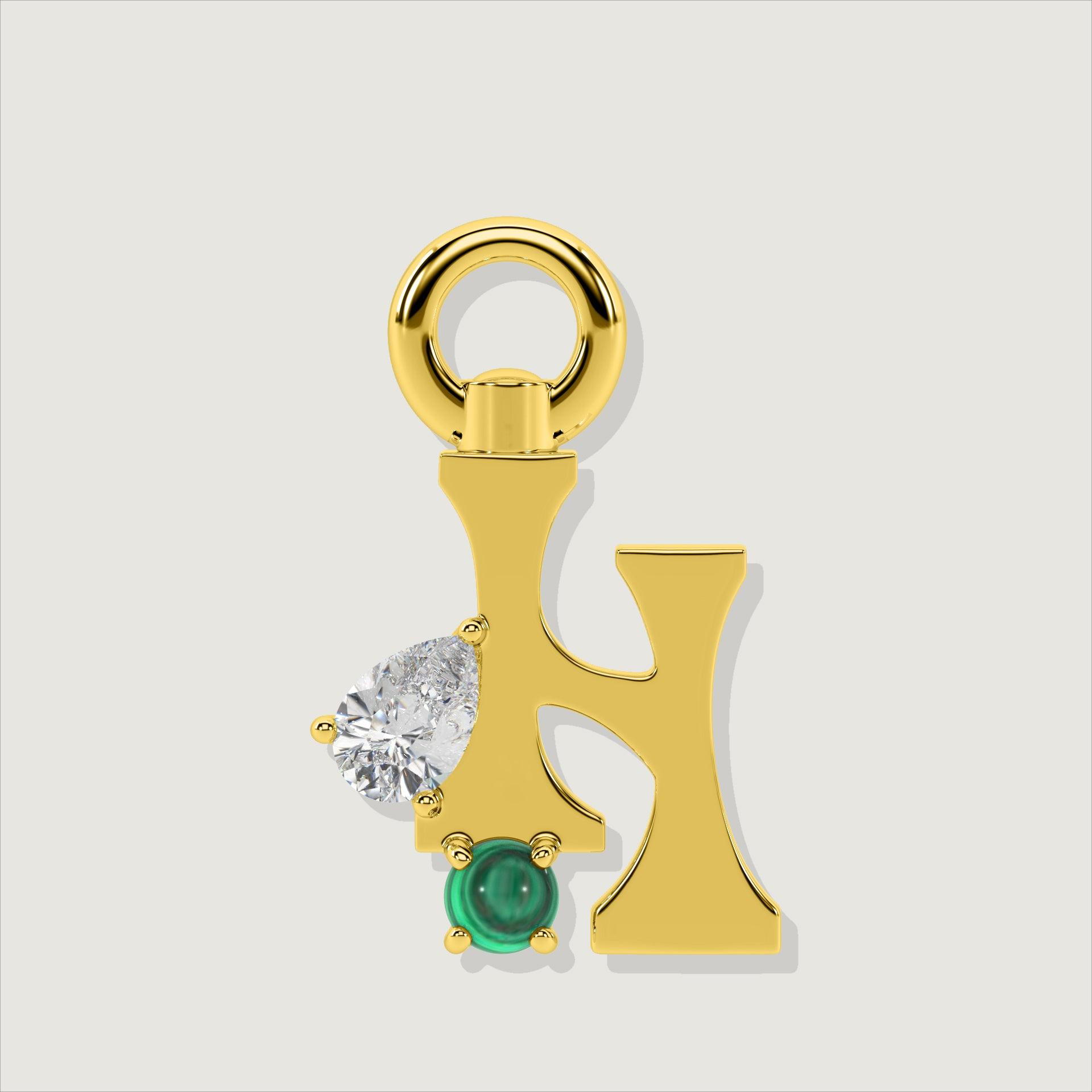 Gold letter H charm featuring round clear stone and round green malachite accent.