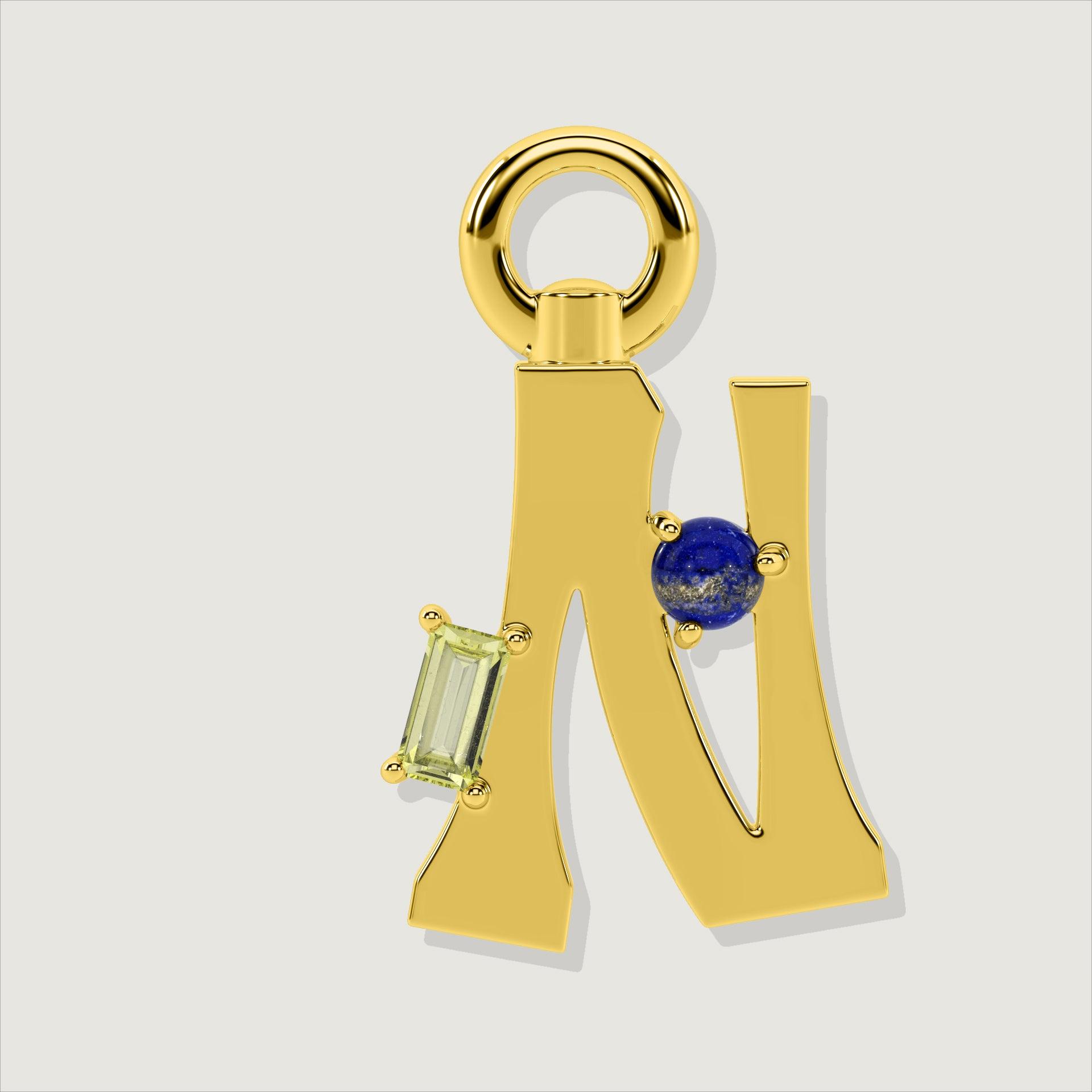 Gold letter N charm with a yellow baguette-cut gem and a round lapis-blue stone.