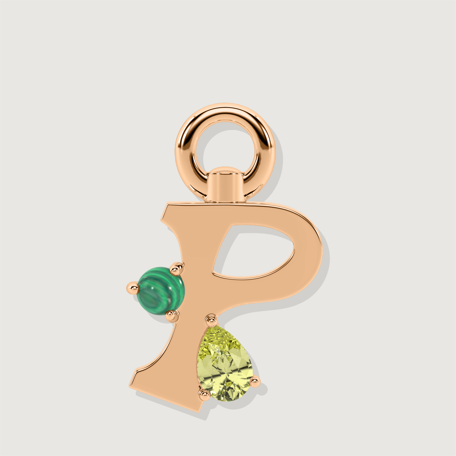 Rose gold letter P charm set with a green malachite sphere and a yellow pear-cut gemstone.