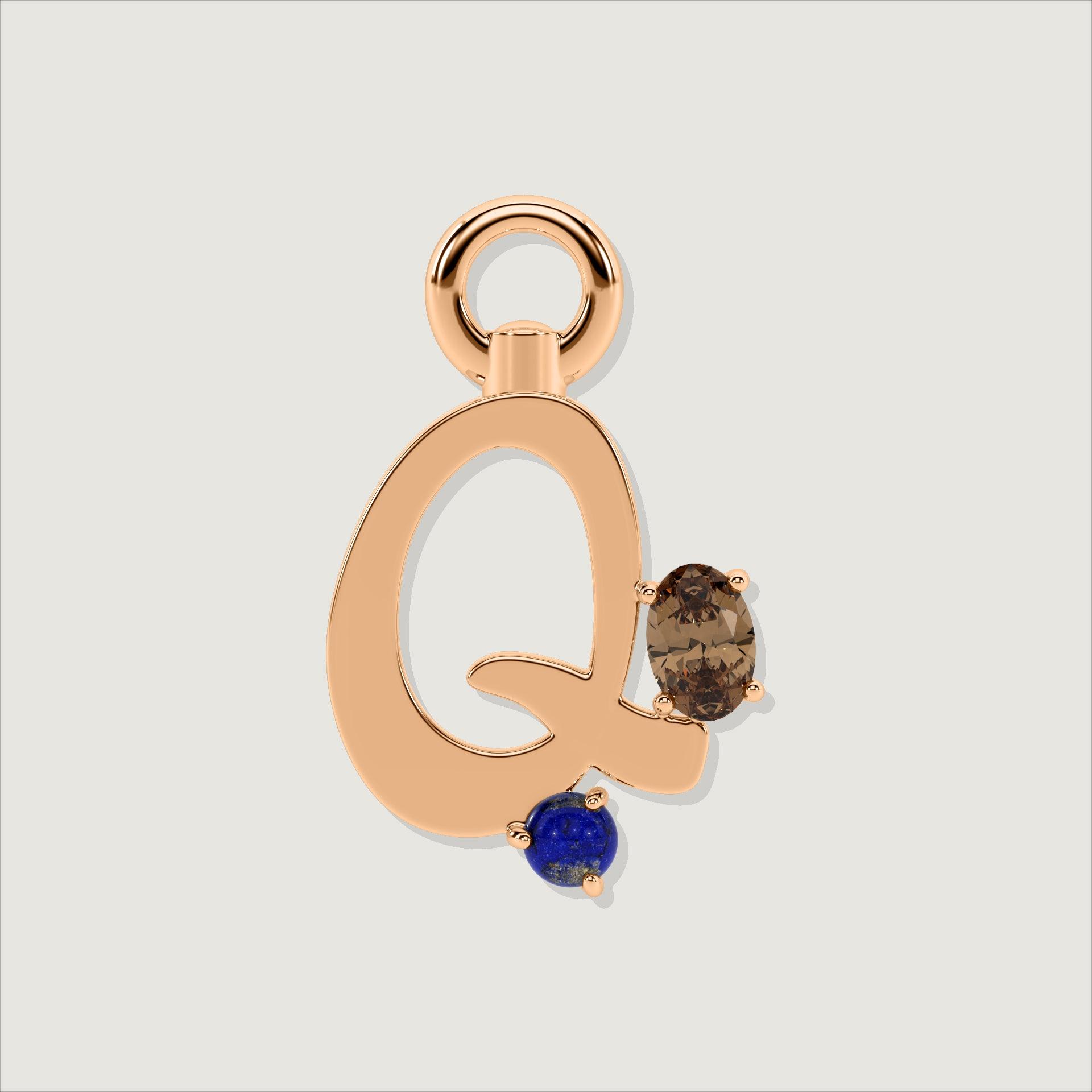 Rose gold letter Q charm decorated with an oval smoky quartz and a small round lapis-blue gem.