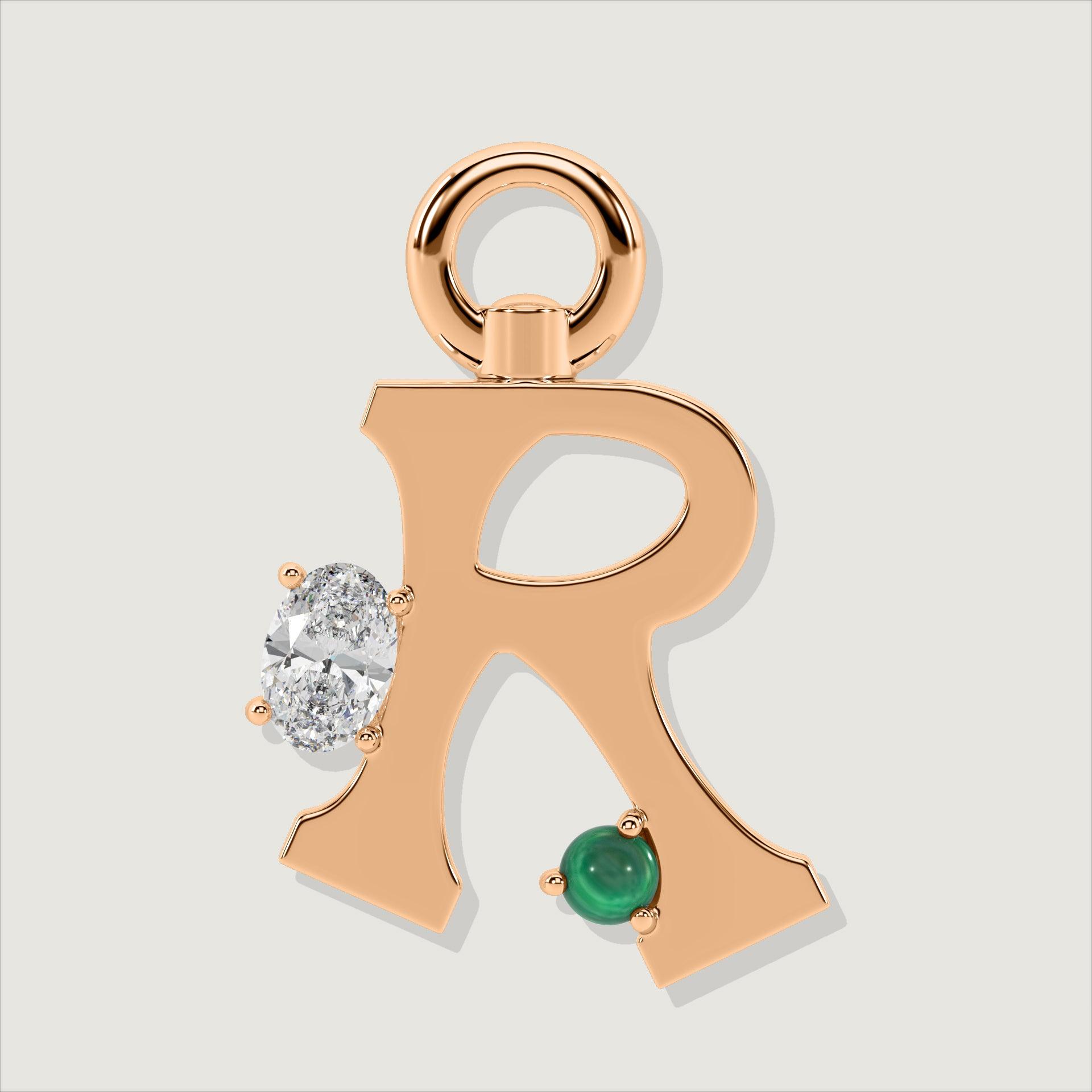 Rose gold letter R charm embellished with an oval clear stone and a green malachite sphere.