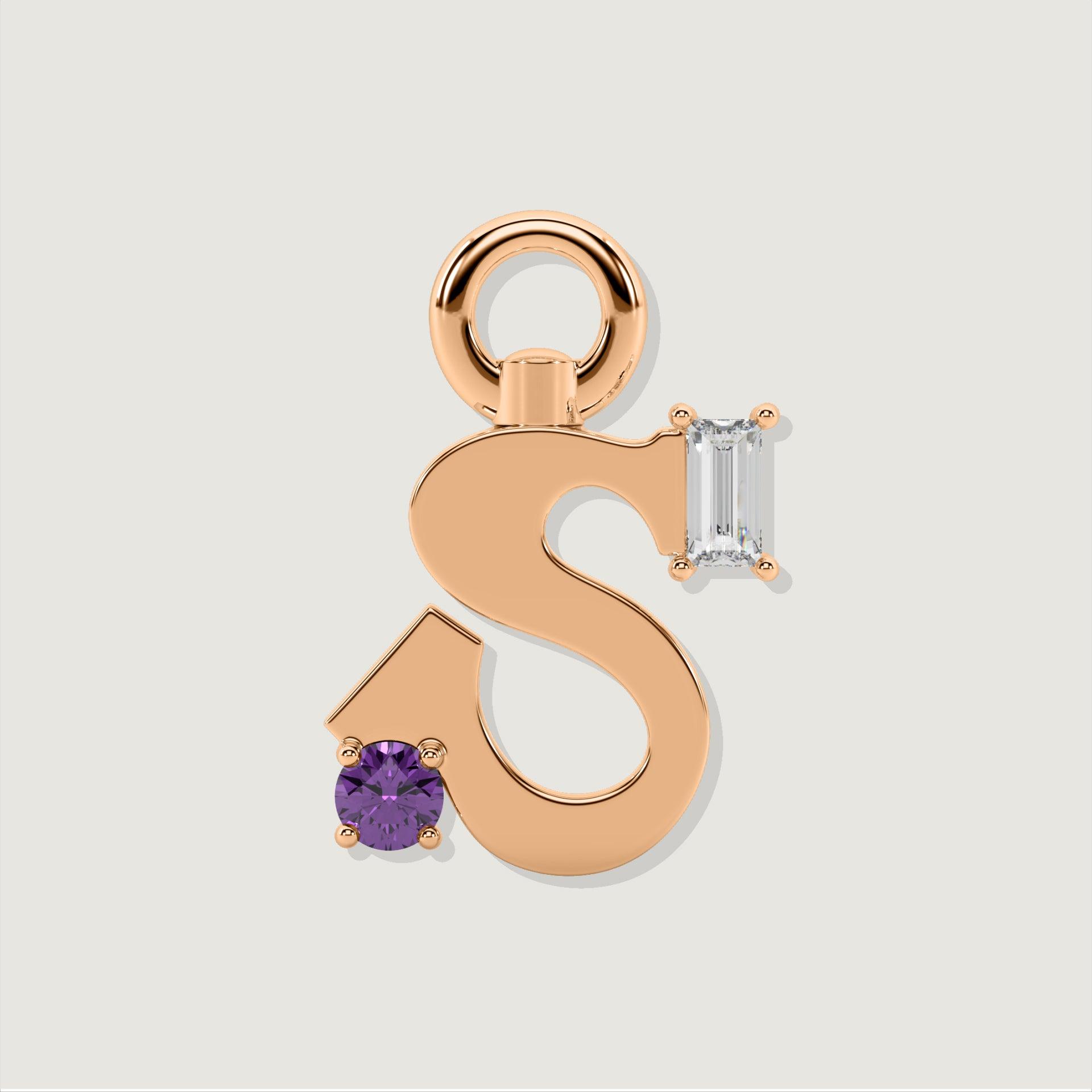 Rose gold letter S charm featuring a round purple gemstone and a baguette-cut clear stone.