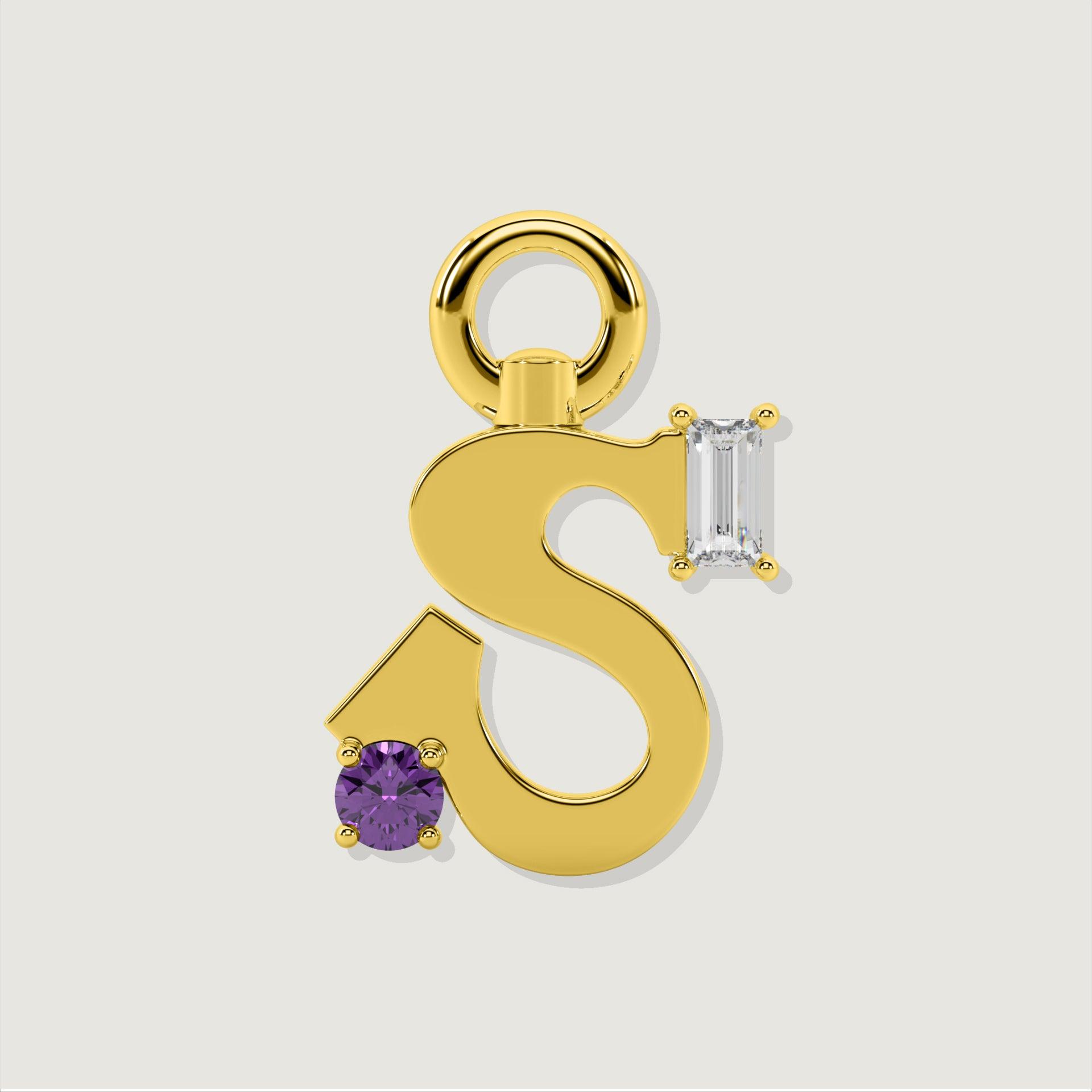 Gold letter S charm featuring a round purple gemstone and a baguette-cut clear stone.