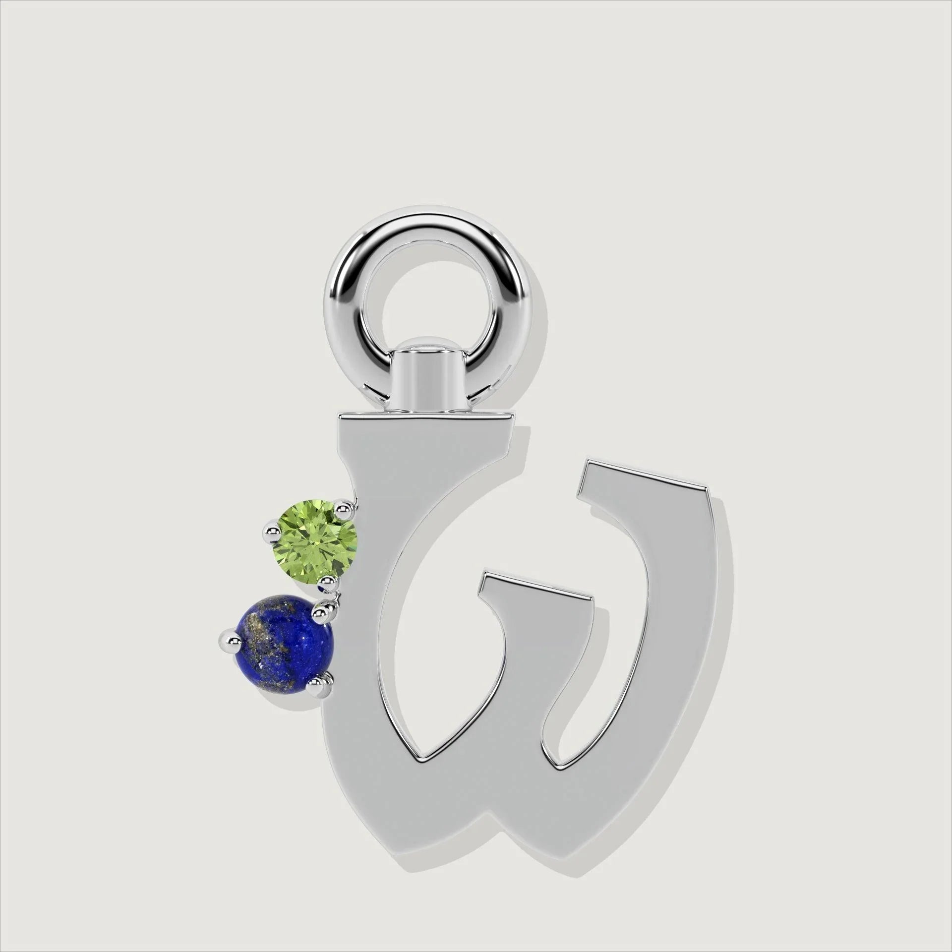 Silver letter W charm with a round green gemstone and a small blue gem.