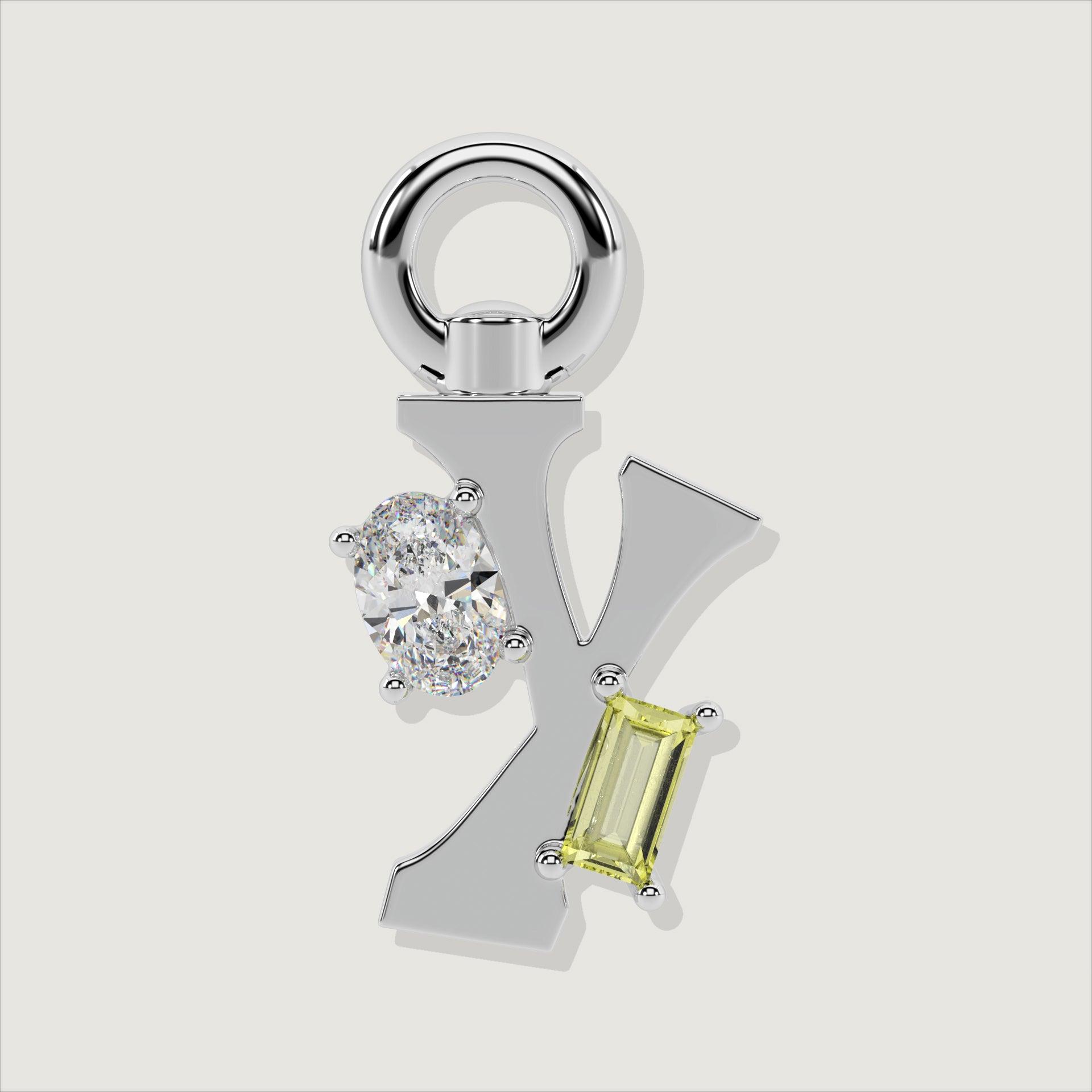 Silver letter Y charm accented with an oval clear stone and a baguette-cut yellow gemstone.