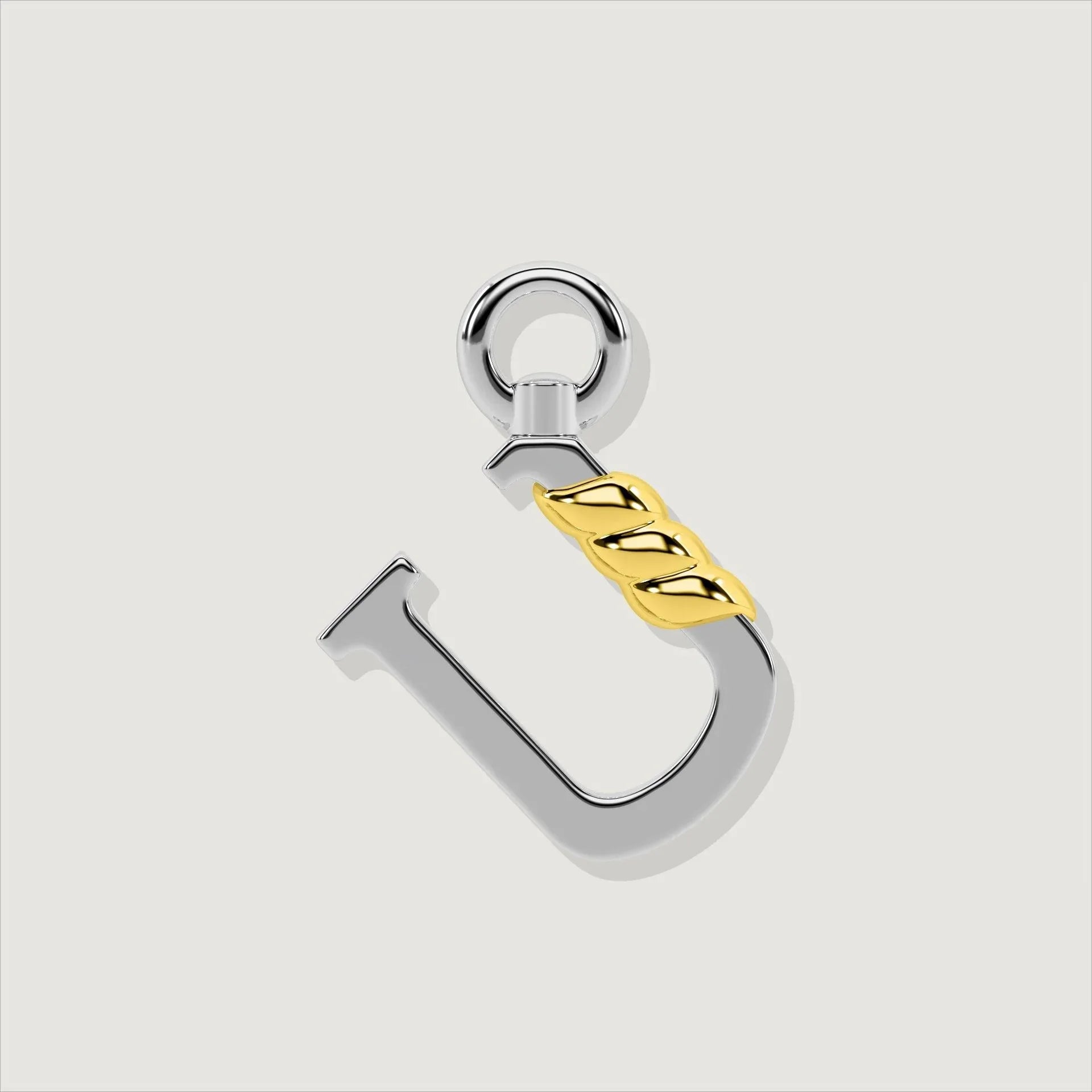 Silver letter U charm with gold rope twist detail.