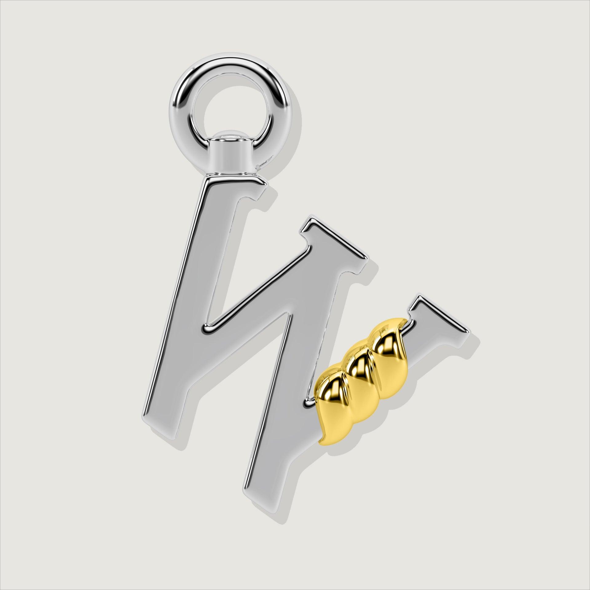 Silver letter W charm with gold rope twist detail.