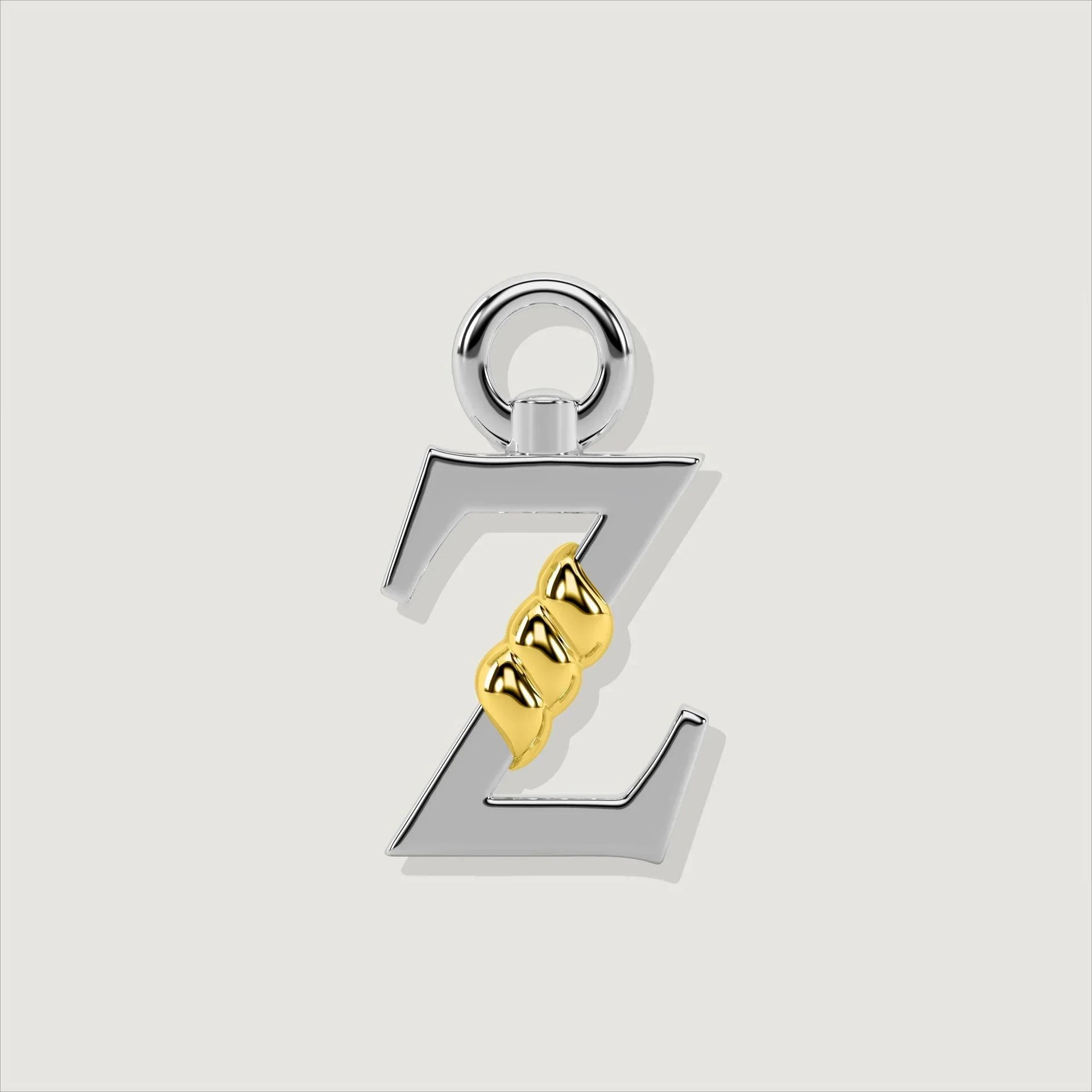Silver letter Z charm with gold rope twist detail.