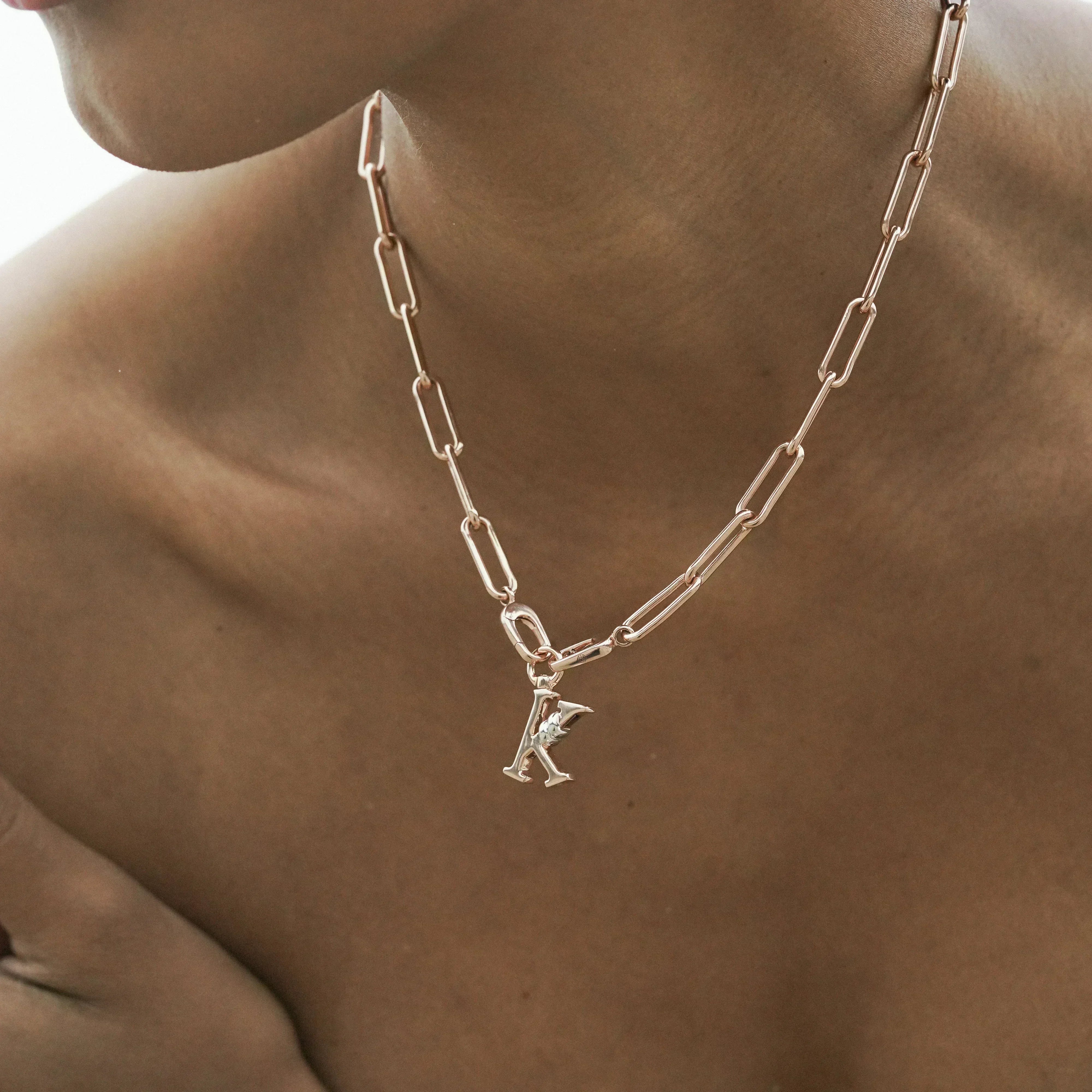 C | Unius Letter Charm